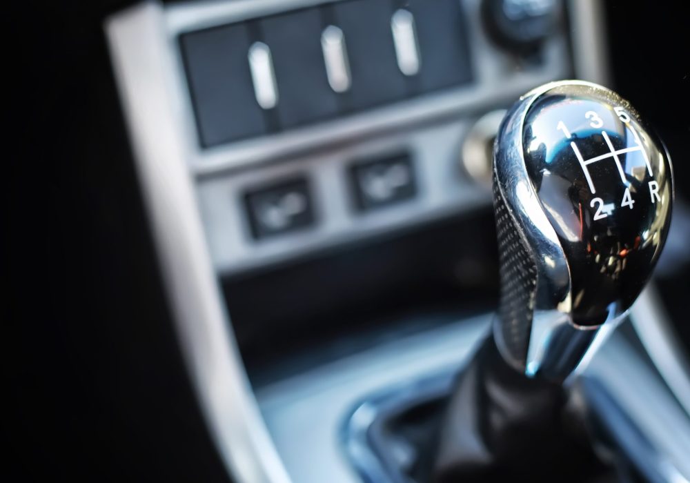 Gear lever. Manual Transmission. Hand on the gear shift in a car.